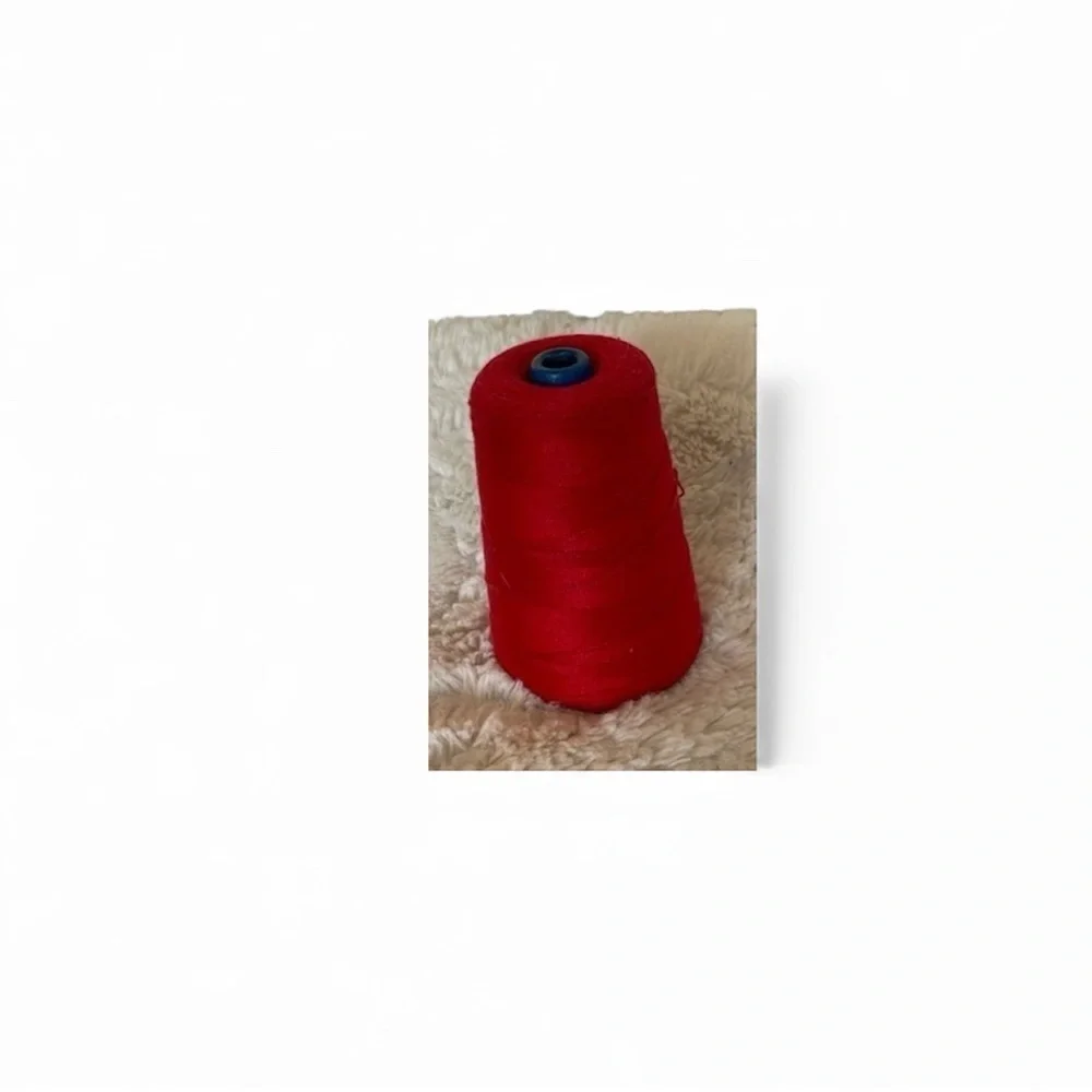 A spool of red cotton for sewing and crochet work basically new and vintage